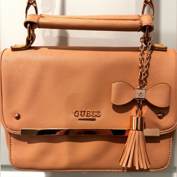 GUESS Peach Saffiano Crossbody Top Handle Bag w/ Bow Tassel & Long Strap - Picture 4 of 16